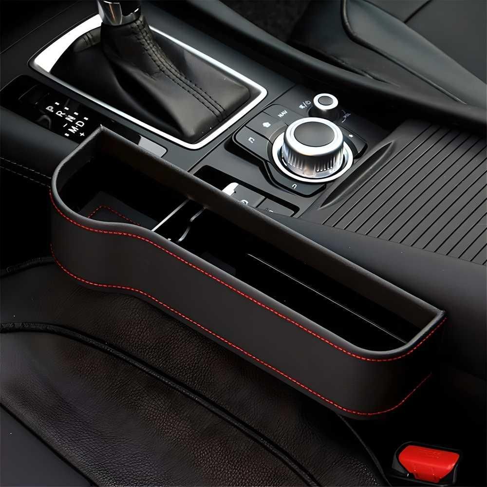 Car console organizer with red stitching on a car dashboard