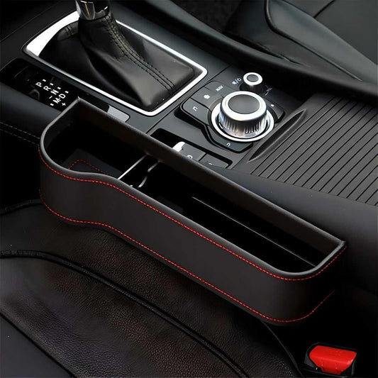 Car console organizer with red stitching on a car dashboard