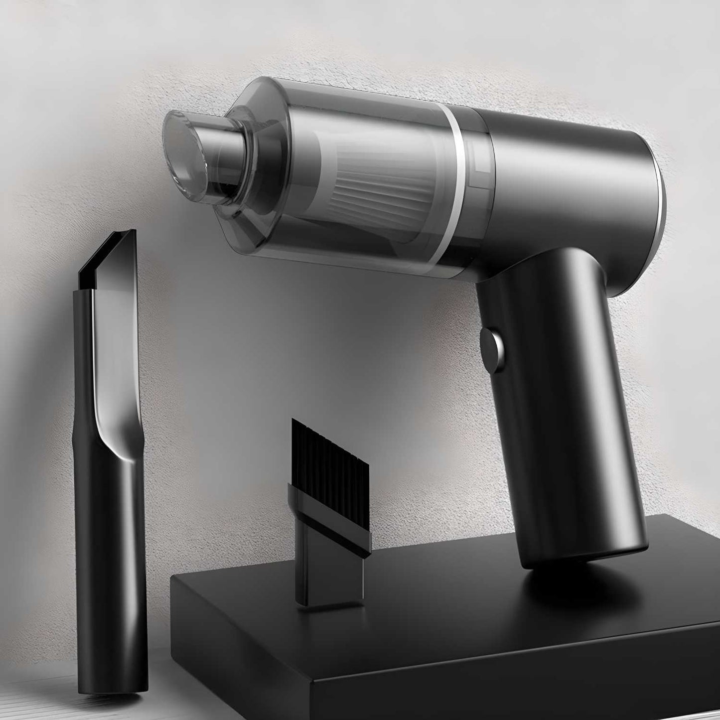 Silver handheld vacuum cleaner with attachments on a gray background