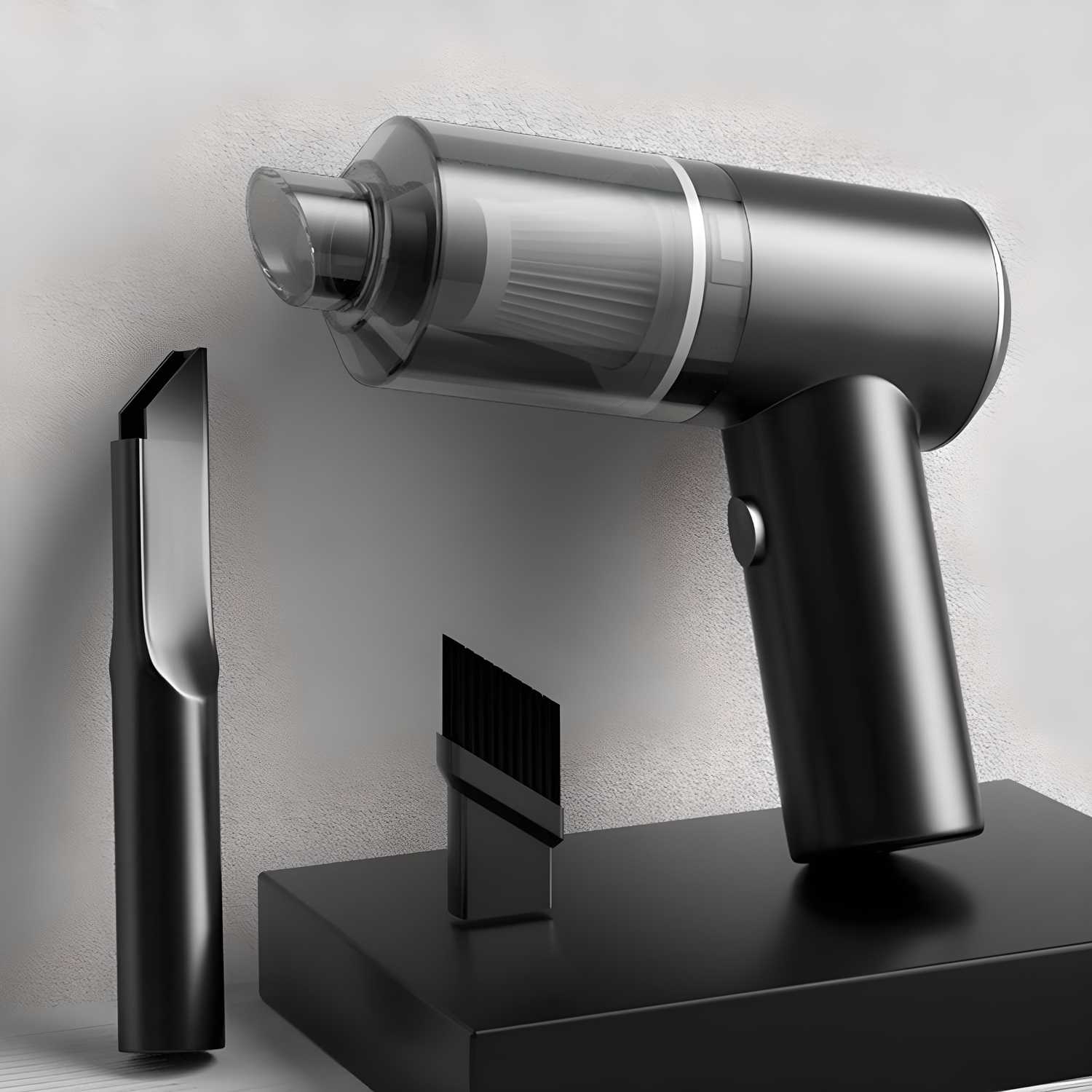 Silver handheld vacuum cleaner with attachments on a gray background