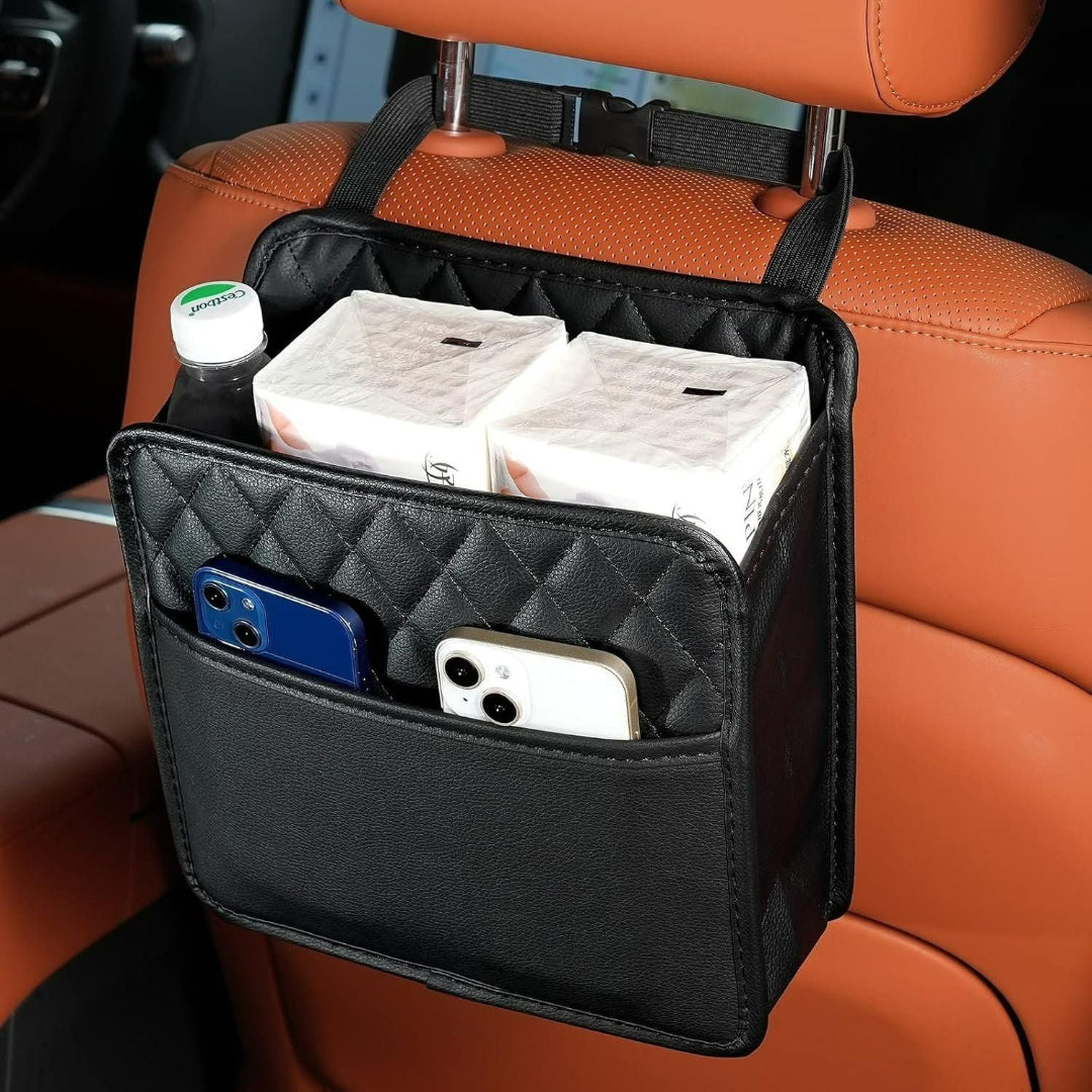 Car organizer hanging from a car seat with items inside