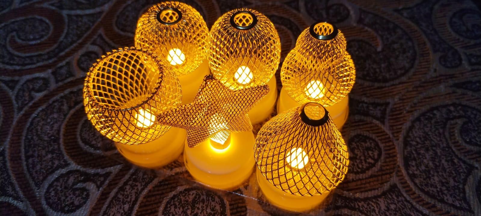 String lights with mesh-covered bulbs on a textured surface